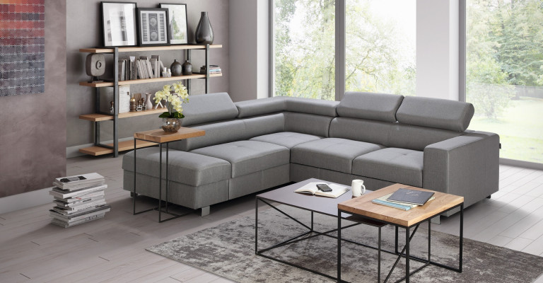 Canapé d'angle gris avec fonction lit, design moderne en L