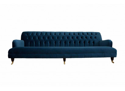 Canapé de designer luxueux de style Chesterfield avec quatre places de couleur bleue.