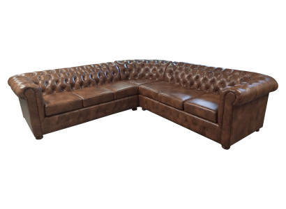 Canapé d'angle Chesterfield en forme de L en cuir marron pour salon.