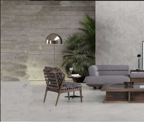 Ensemble de salon moderne avec canapé d'angle en L, fauteuil et table basse au design luxueux.
