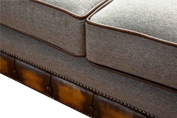 Canapé moderne trois places de luxe gris en tissu textile.