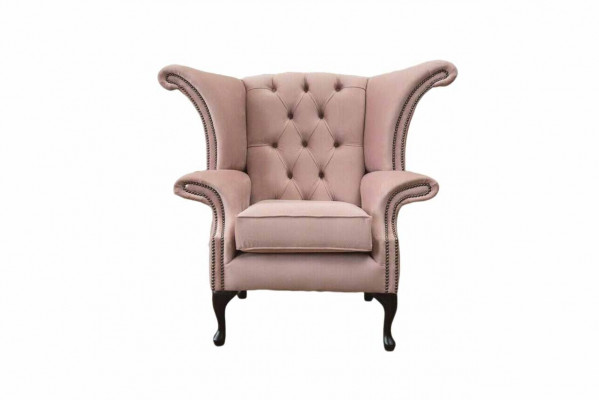 Fauteuil à ailes en velours, canapé rembourré design Chesterfield en tissu.