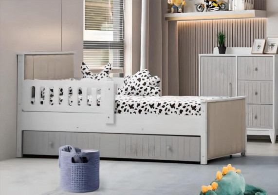 Lit d'enfant pratique de couleur grise pour de douces heures de sommeil. Luxueux