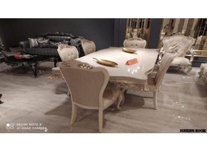 Ensemble de salle à manger ivoire. Table à manger élégante et classique accompagnée de 6 chaises Chesterfield rembourrées.