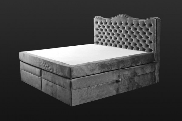 Cadre de lit gris style chesterfield. Design de chambre élégant. Meubles classiques en tissu.