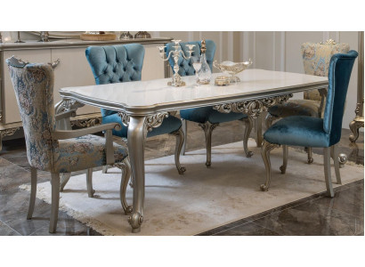 Magnifique table à manger au design classique avec un dessus de table exclusif.