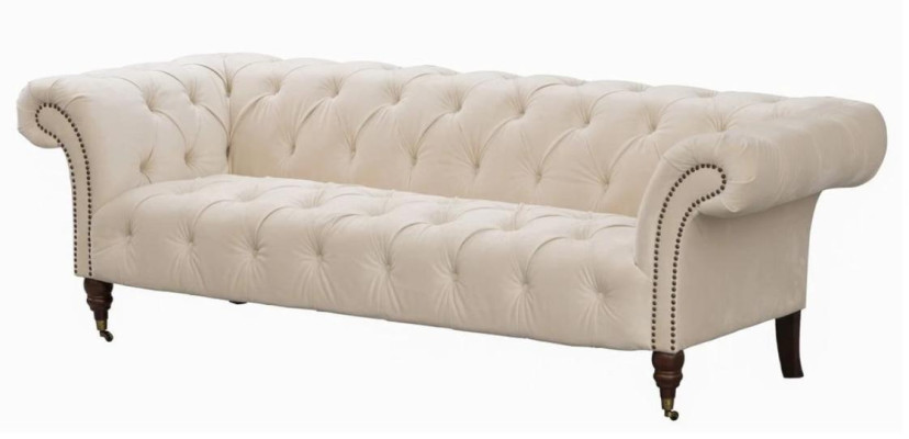 Canapé beige design moderne trois places Chesterfield en tissu.