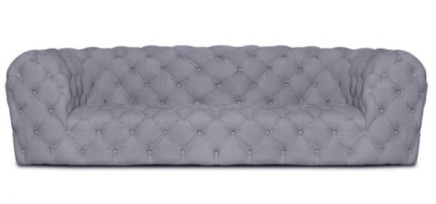Canapé de club de luxe Chesterfield quatre places XXL pour salon exclusif.