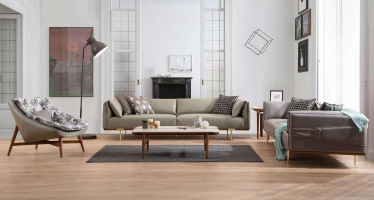 Ensemble de salon de luxe conçu par un designer en cuir, comprenant deux canapés et un fauteuil en tissu.