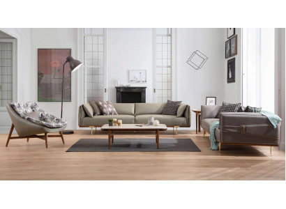 Ensemble de salon de luxe conçu par un designer en cuir, comprenant deux canapés et un fauteuil en tissu.