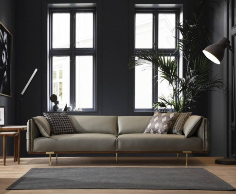 Ensemble de salon de luxe conçu par un designer en cuir, comprenant deux canapés et un fauteuil en tissu.