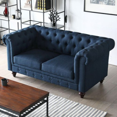 Canapé deux places Chesterfield style anglais en couleurs rose, multicolore, jaune et bleu.