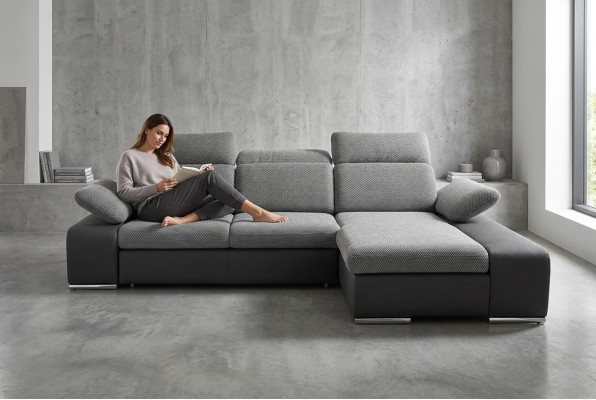 Canapé d'angle design en cuir multifonction avec revêtement textile.