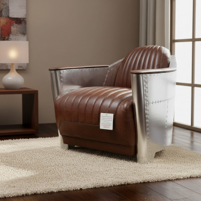 Fauteuil Club de style aviateur en cuir art déco avec finition chrome.