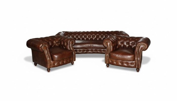 Canapé d'angle Chesterfield marron dans le salon de canapé d'angle rembourré.