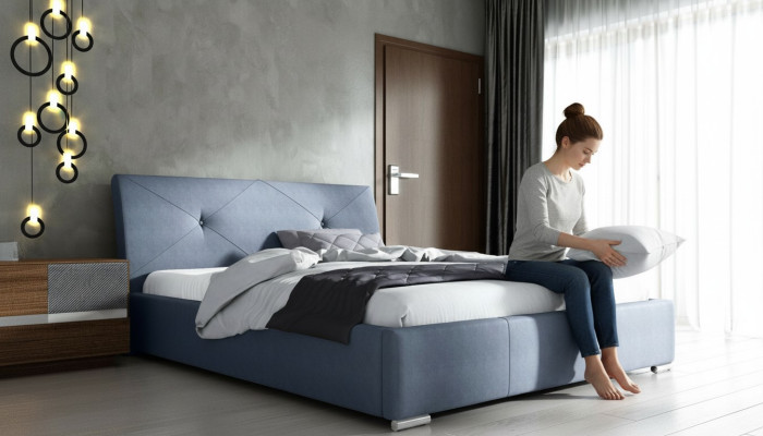Lits doubles d'hôtel en tissu bleu pour chambre à coucher en bois bleu.
