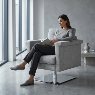 Canapé design Lounge en tissu gris Siège détente d'un fauteuil en tissu meuble en tissu gris.