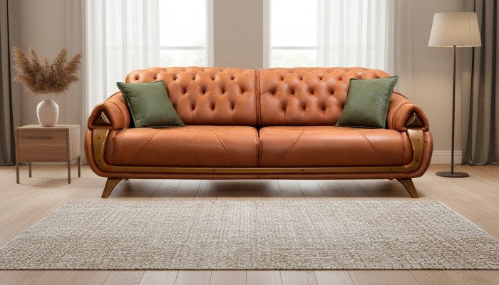 Un canapé-lit trois places de luxe en tissu classique pour trois personnes.