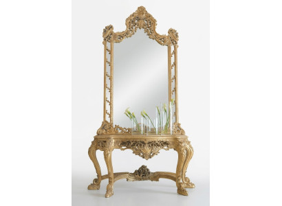 Luxueuse console et miroir ciselés dans un cadre élégant.