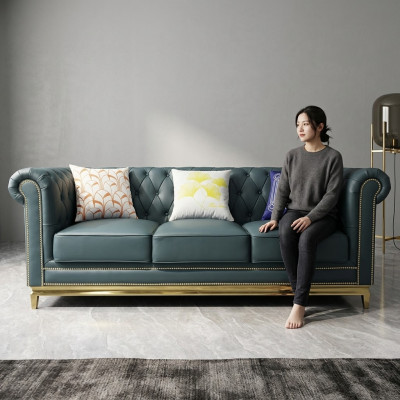 Canapé Chesterfield Trois places en textile avec structure en acier inoxydable