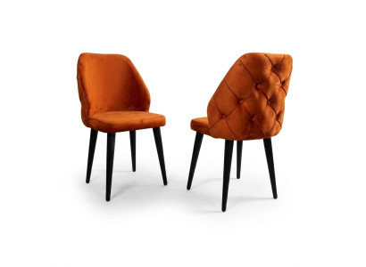 Chaise rembourrée en bois Chesterfield orange sur pieds noirs dans la salle à manger