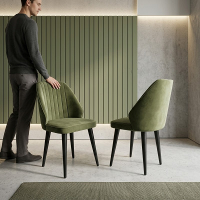 Chaise verte sur des pieds en bois noirs pour la salle à manger, nouveau modèle de confortables.