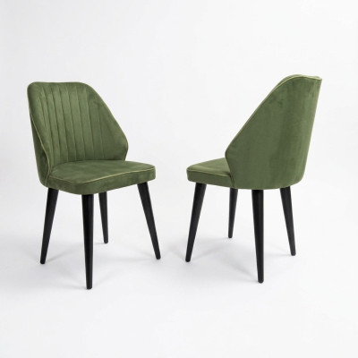 Chaise verte sur des pieds en bois noirs pour la salle à manger, nouveau modèle de confortables.