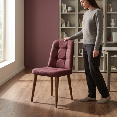 Un fauteuil rose d'origine sur pieds en bois pour votre salle à manger nouveau modèle