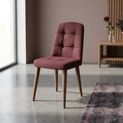 Un fauteuil rose d'origine sur pieds en bois pour votre salle à manger nouveau modèle