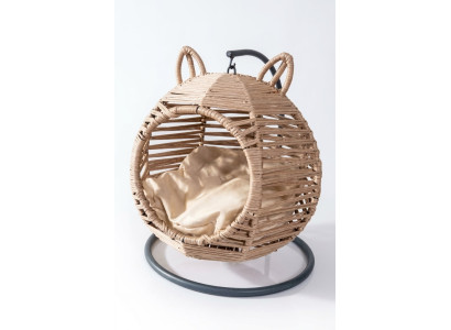 Lit de luxe pour chat pivotant rond moderne beige, avec un meuble en bois moderne.