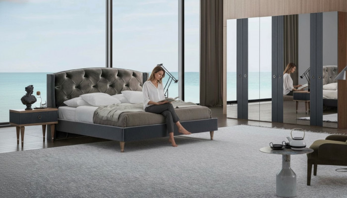 Ensemble de chambre moderne Chesterfield avec lit double designer et tables de chevet.