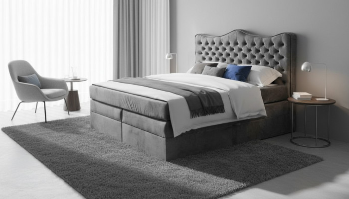 Cadre de lit gris style chesterfield. Design de chambre élégant. Meubles classiques en tissu.