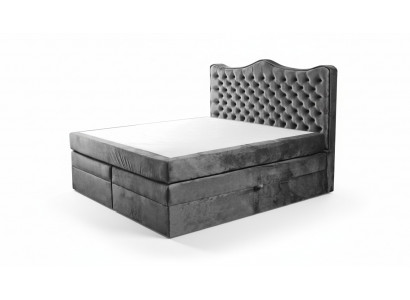 Cadre de lit gris style chesterfield. Design de chambre élégant. Meubles classiques en tissu.
