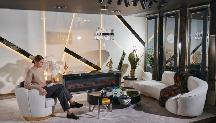 Ensemble luxueux de salon blanc avec canapé 3 places, fauteuil, et table basse ronde.