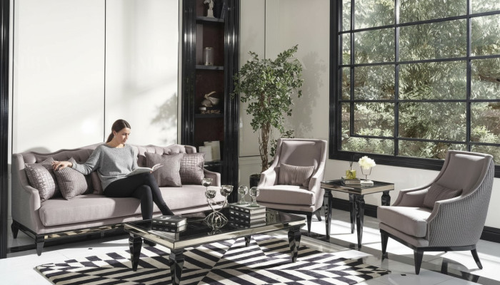 Ensemble de canapé 3 places en tissu gris comprenant un canapé et 3 fauteuils.