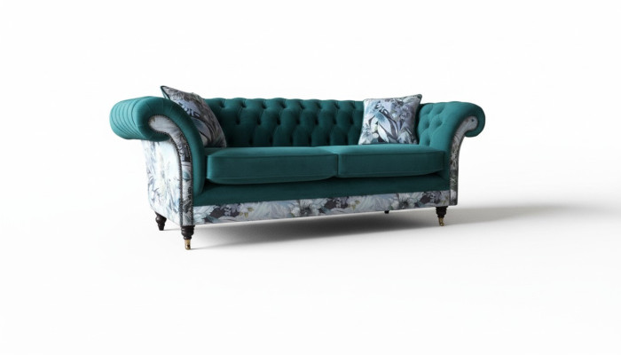 Un canapé Chesterfield trois places vibrant dans une délicate couleur émeraude avec un motif floral.