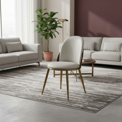 Chaise ornée élégante en acier inoxydable, un siège blanc-doré.