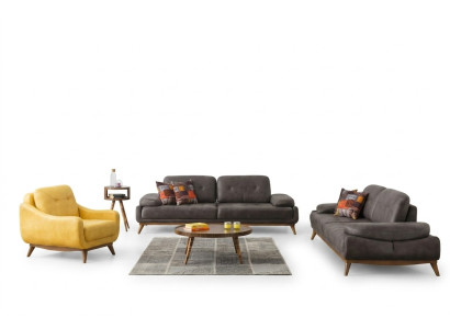 Salon élégant en suite de designer avec canapé trois places et fauteuil moderne en 2 pièces.