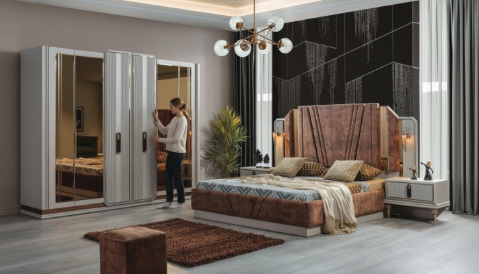 Ensemble de chambre exclusive comprenant un lit double, 2 tables de chevet et une armoire.