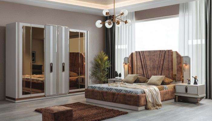 Ensemble de chambre exclusive comprenant un lit double, 2 tables de chevet et une armoire.
