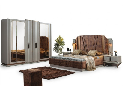 Ensemble de chambre exclusive comprenant un lit double, 2 tables de chevet et une armoire.