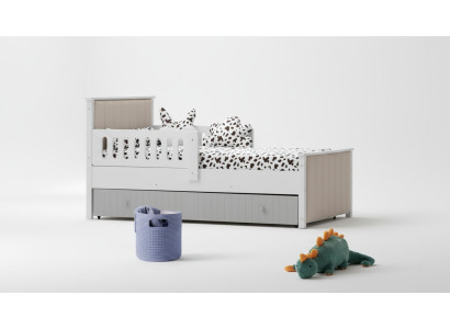 Lit d'enfant pratique de couleur grise pour de douces heures de sommeil. Luxueux