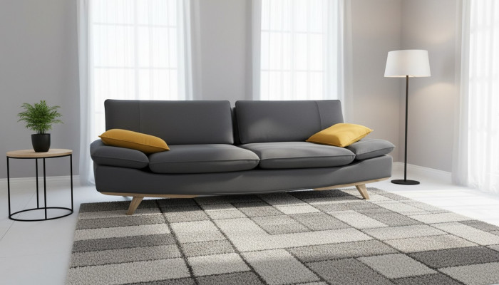 Canapé trois places gris élégant et stylé pour un salon moderne et luxueux.