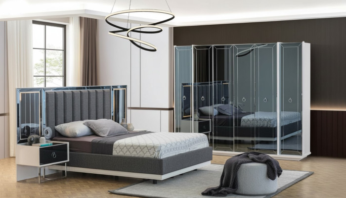 Ensemble de chambre à coucher design avec lit double, table de chevet et armoire.