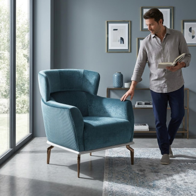 Fauteuil design moderne de couleur verte pour le salon. Meuble de siège en textile de luxe.