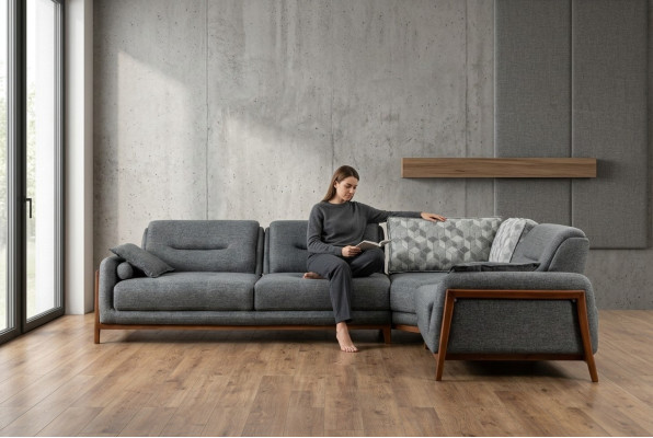 Canapé d'angle design en L de luxe avec revêtement textile pour aménager le salon.