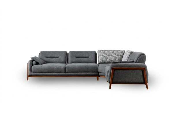 Canapé d'angle design en L de luxe avec revêtement textile pour aménager le salon.
