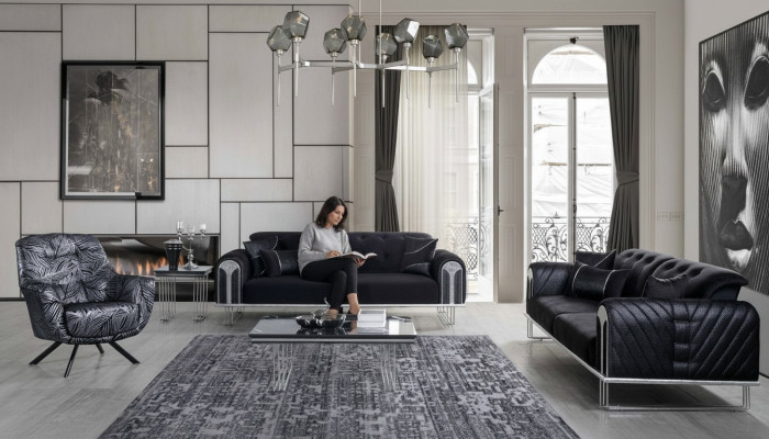 Ensemble de sièges pour salon noir-gris composé d'un canapé 3 places et de deux fauteuils.
