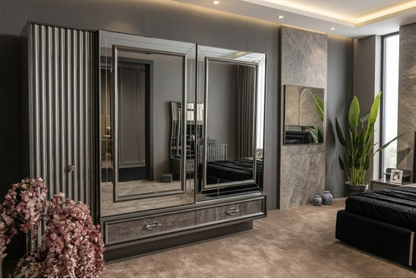 Armoire en bois design avec portes miroir et tiroirs pour la chambre.