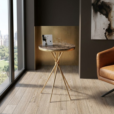 Table d'appoint ronde de luxe en acier inoxydable pour salon avec pied en acier.